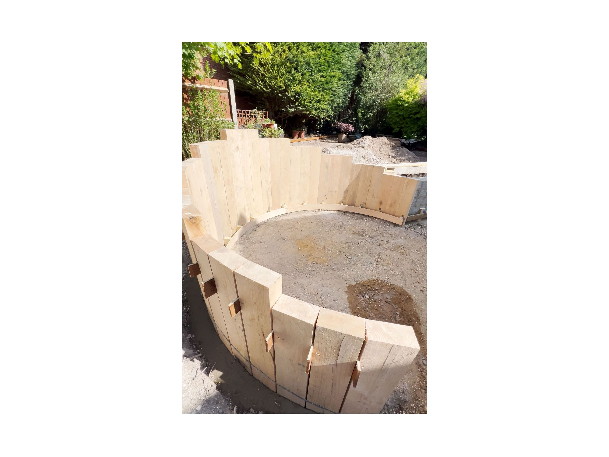 Contemporary garden landscaping project with durable composite decking and porcelain patio