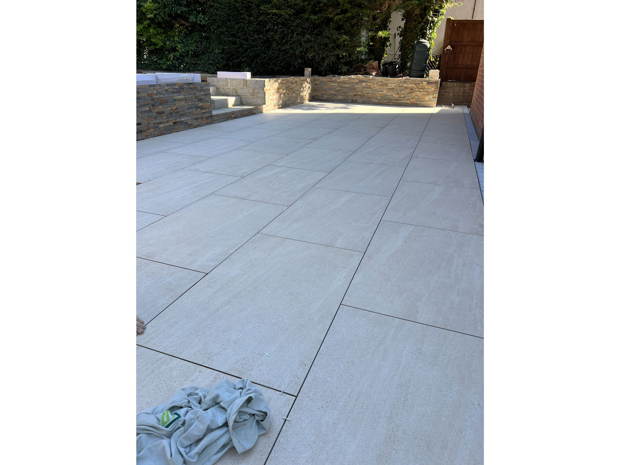 Bespoke garden transformation with oak garden features, porcelain paving and quality landscaping