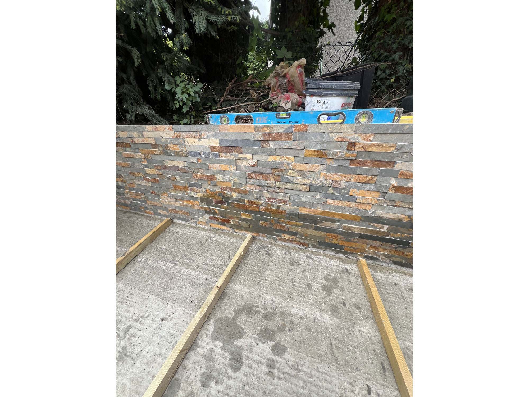 Professional landscaping and garden transformation featuring oak, porcelain paving and decking