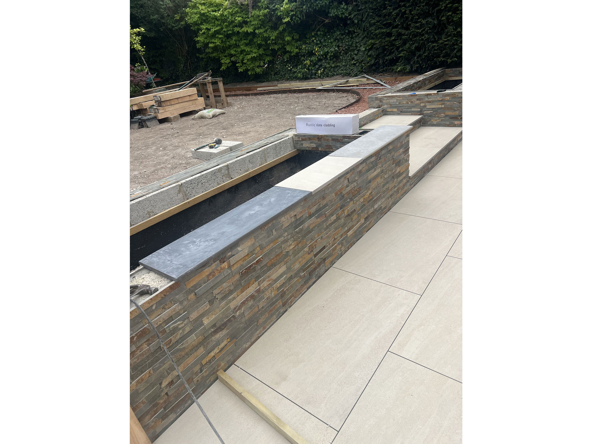 Hertfordshire garden transformation combining premium landscaping, porcelain tiles and decking