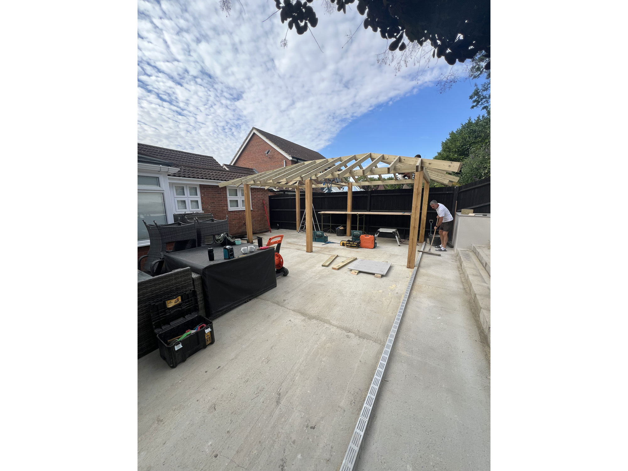 Bespoke outdoor BBQ and dining area within a contemporary landscaped garden