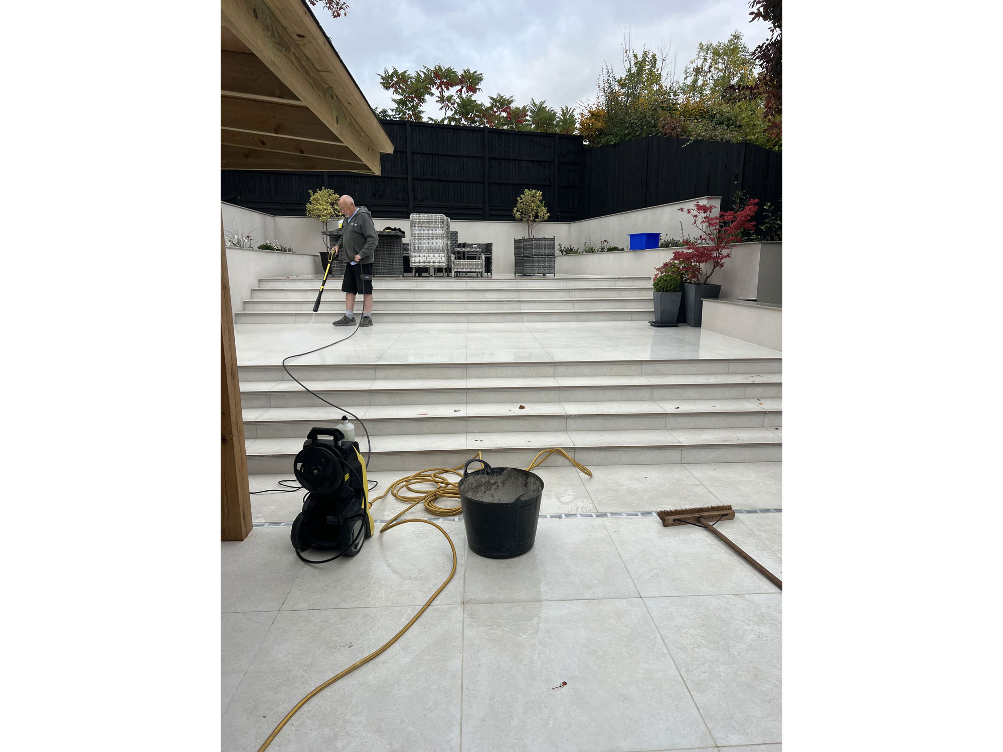 Outdoor TV and seating area creating a luxurious garden entertainment space