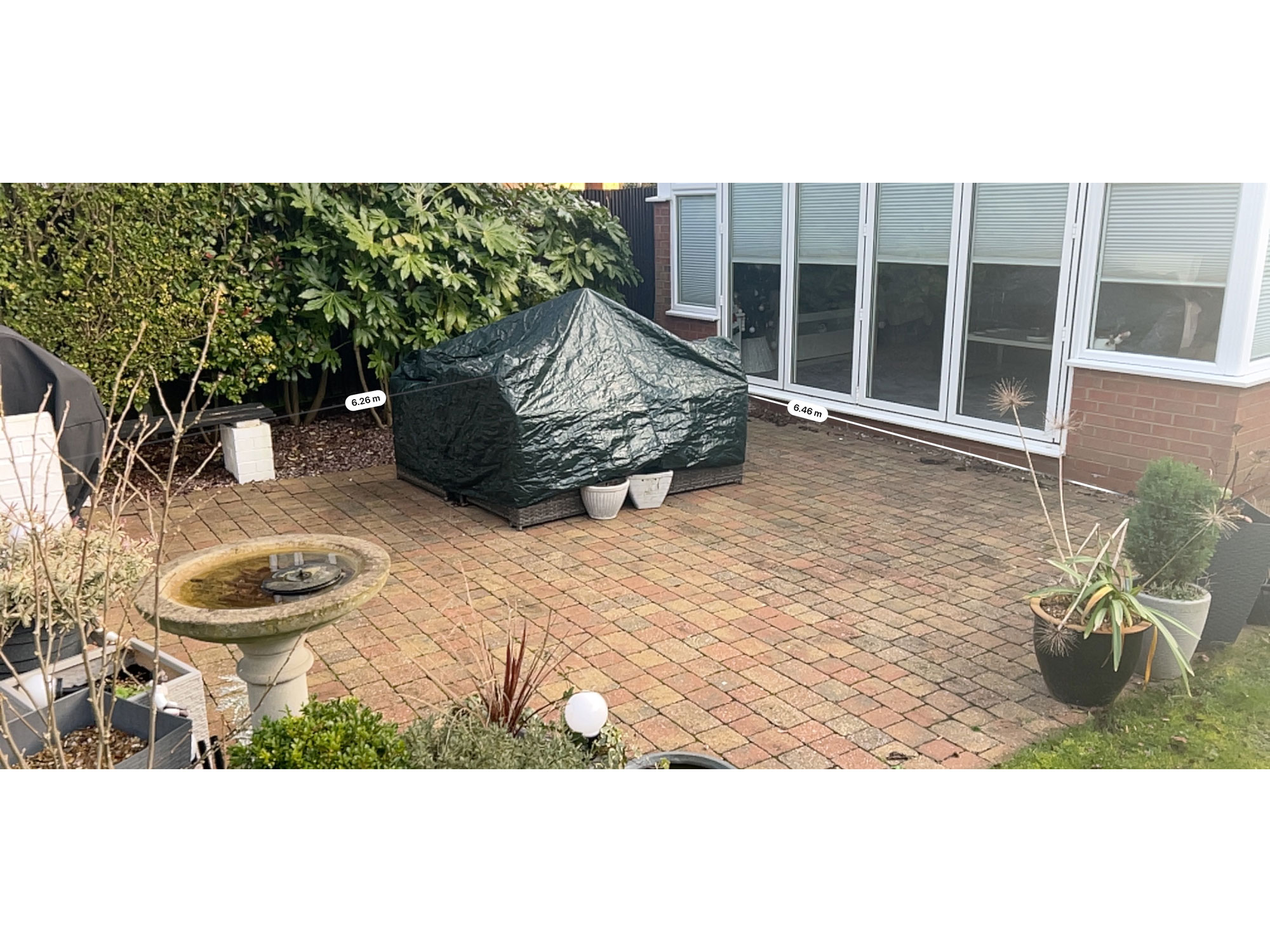 Modern porcelain tiles used to create a stylish contemporary garden patio